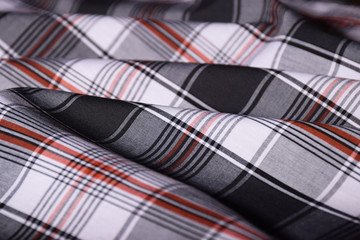 Tartan plaid patterned material laid out on a table