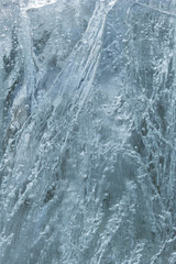 Abstract photo of close-up of frozen air bubbles in ice in the winter.