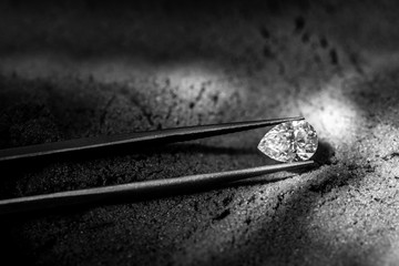 Pear Cut Diamond in Jewelry Tweezers