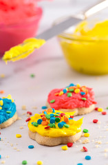 Cookies Decorated with Primary Colored Frosting with Rainbow Sprinkles
