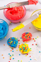 Cookies Decorated with Primary Colored Frosting with Rainbow Sprinkles