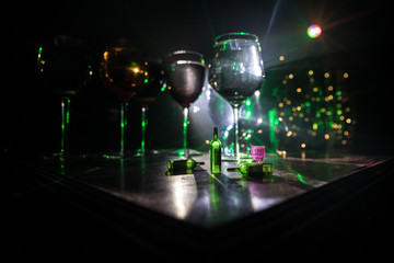 Goblet of white wine on wooden table on wooden wall background