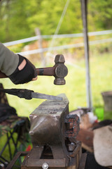 Blacksmith with hammer and anvil