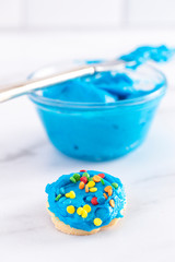 Cookies Decorated with Bright Blue Icing and Colorful Sprinkles