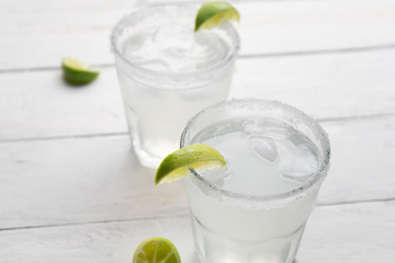 Mexican lime margarita cocktail on white background