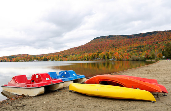 Overlooking of Lake Elmore State Part With Beautiful Autumn Foliage, Colorful Kayaks  and Water reflections  at Elmore, Vermont, USA