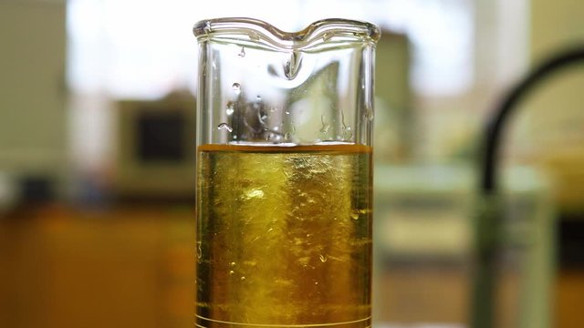 Two miscible liquids in a graduated cylinder showing mixing. 