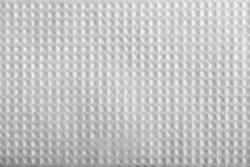 Texture of white paper napkin, square embossed.