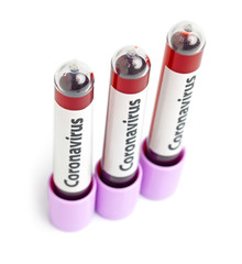 Macro blood samples in three test tubes on white background. Epidemic Mers-CoV Coronavirus researching and treatment concept.