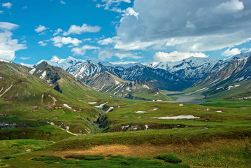 Mountains of Denali National Park and Preserve in the state of Alaska during early summer. It encompasses 6 million acres of Alaska’s interior wilderness. 