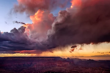 Tuinposter Dramatic storm clouds over the Grand Canyon at sunset in Grand Canyon National Park, Arizona, USA © JSirlin