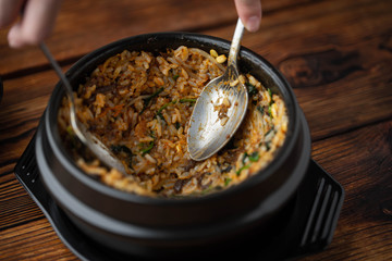 mixing korean famouse hot stone bowl bibimbap
