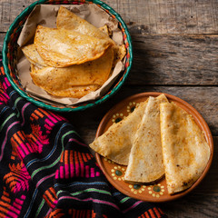 Mexican basket tacos also called "de canasta" on wooden background