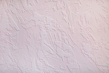 Stucco white wall, background from patterns on the wall