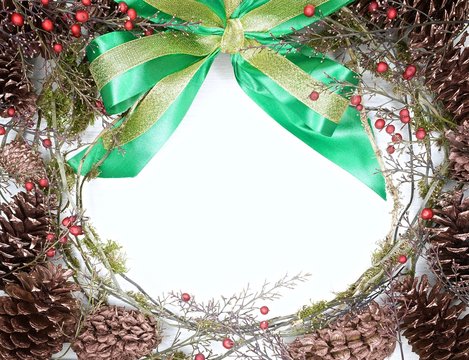 pine cones wreath with green bow and berries - Powered by Adobe
