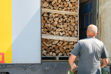 lumber truck, open body shows firewood