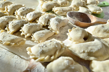 Cheese ravioli lie on the kitchen table