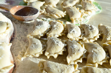 Cheese ravioli lie on the kitchen table