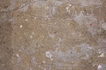 Concrete wall texture. Wall after removing paint. Bare cement. Rough surface. Gray faceless background to create a natural surface. Preparation for painting.