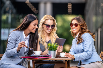 Business women in a meeting using tablet