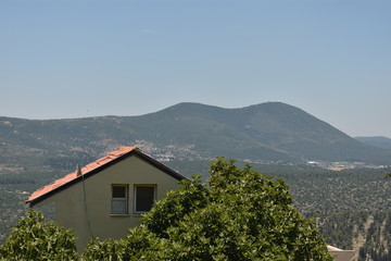 Landscape of mountains and a building in the mystical city of Tzfat Israel