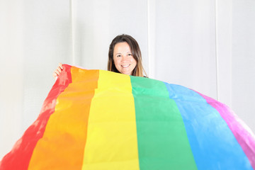 Lesbian girl having fun with gay/lesbian flag.
