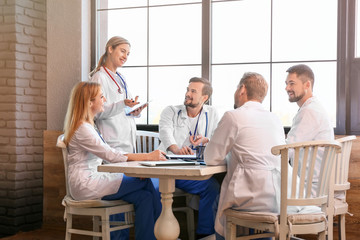 Doctors at meeting in modern clinic
