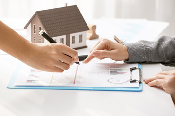Real estate agent working with client in office