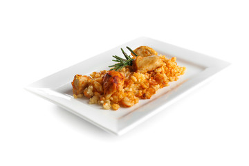 Plate with tasty rice and chicken on white background