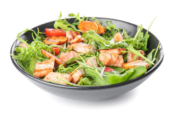 Plate with tasty salmon salad on white background