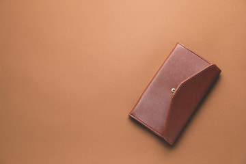 Stylish wallet on color background