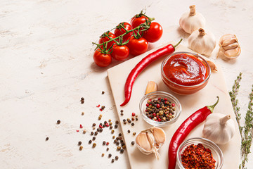 Naklejka na ściany i meble Tomato sauce with ingredients on white background