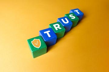 Colorful cubes with "trust" on it
