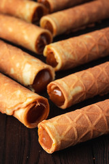Waffle tubule with boiled condensed milk close up