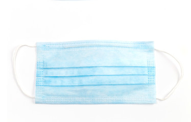 A close-up shot of a disposable surgical mask