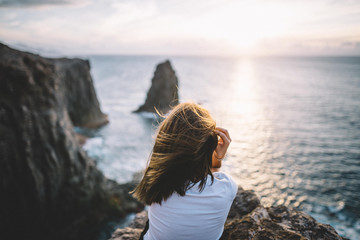 Woman thinking in a hill with views at ocean