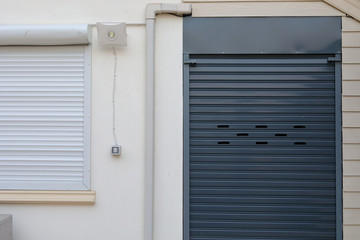 black roller shutter door closed security in house