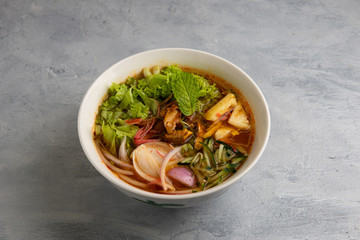 laksa noodle soup with grey background