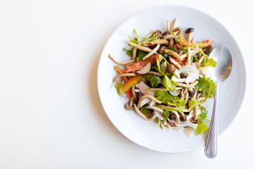 Mushroom salad on white color plate background