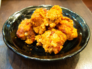 Fried chicken in Japanese style (karaage) in black plate background