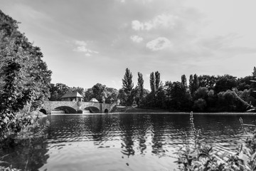 Weir of the river Elster at the city of Leipzig. The elsterwehr in the beautiful Leipzig, Saxony, Germany. The weir in the middle of the Clara Zetkin park near the Red Bull Arena. Black and white 