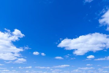 Naklejka na ściany i meble Blue sky background with clouds sunny day