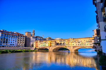 A view of the Arno River towards the Ponte Vecchio in Florence, Italy.