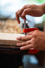 Woodworker in the shop. Carpenter making a pieces for woodturning project. Making a handmade project. Craftsman skills concept.