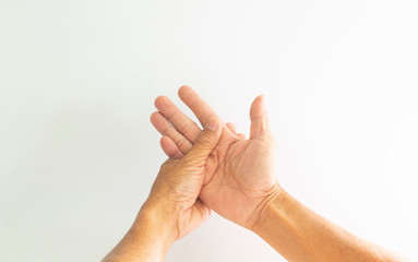 The hands and fingers of the elderly with signs showing illness on a white background