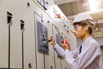 Control Room Engineer. Power Plant Control Panel. Engineer standing in front of the control panel...