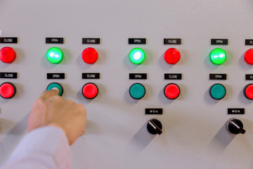 Engineer working on checking and maintenance electrical equipment engineer checking status switchgear with checklist System ready.