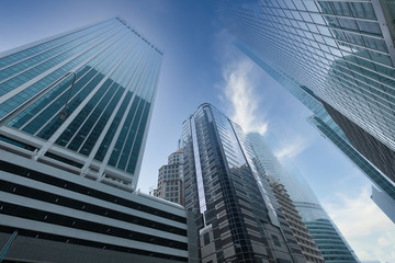Fototapeta na wymiar low angle view of singpaore financial buildings in blue sky 