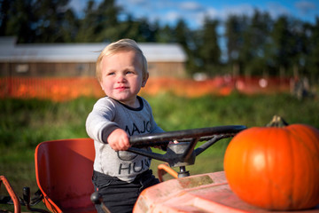 little boy driving a tractor