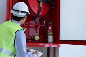 Engineer inspection Fire extinguisher and fire hose.